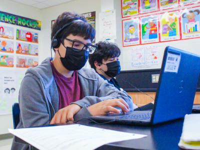 Photo of A student working hard in Science class