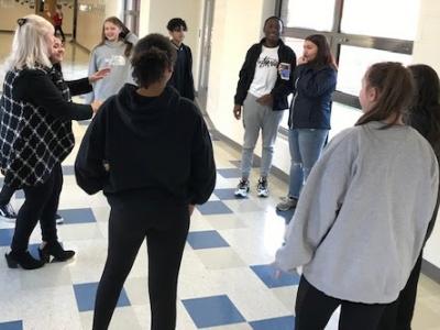 Ms. Williams teaching her students some dance moves for a project! 