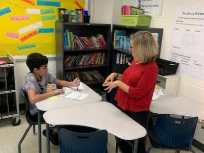Ms. Moran connecting with students in her reading class. 
